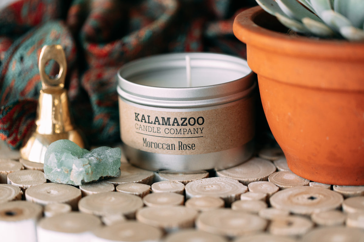 A Moroccan Rose Candle surrounded by trinkets