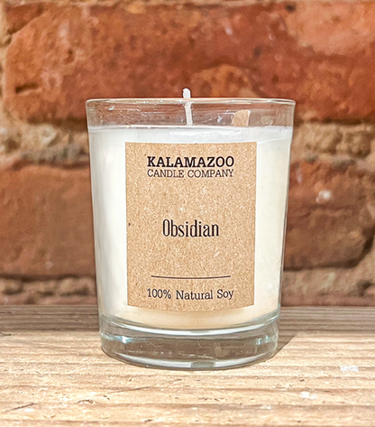 Obsidian Candles Warm island breezes bursting with sugared oranges, lemons, limes and exotic mountain greens, this classic soy candle smells like ripe citrus in a shaded oasis. All Kalamazoo Candles are: 100% natural scented soy wax; produced using locall
