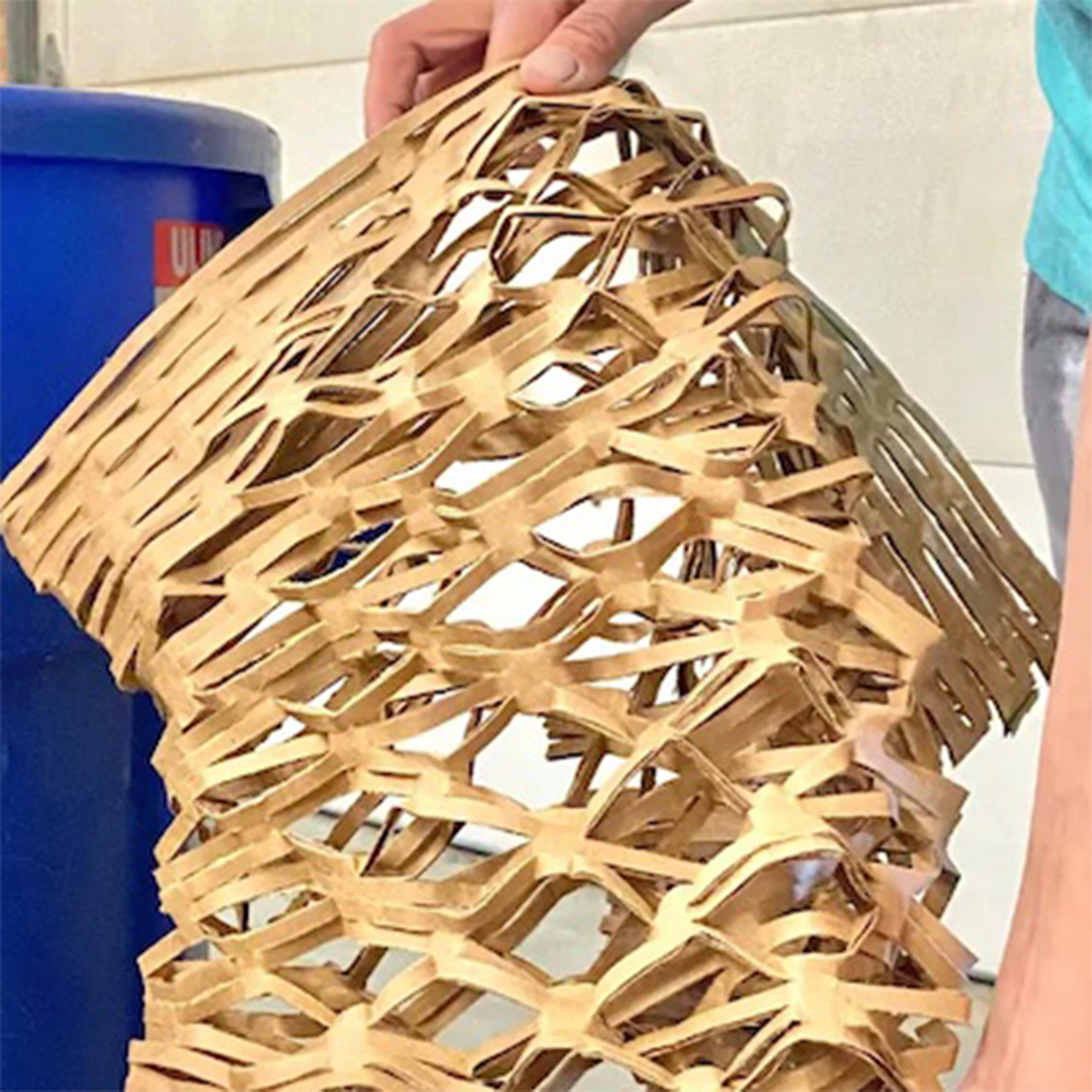 A cardboard box up cycled into packing material