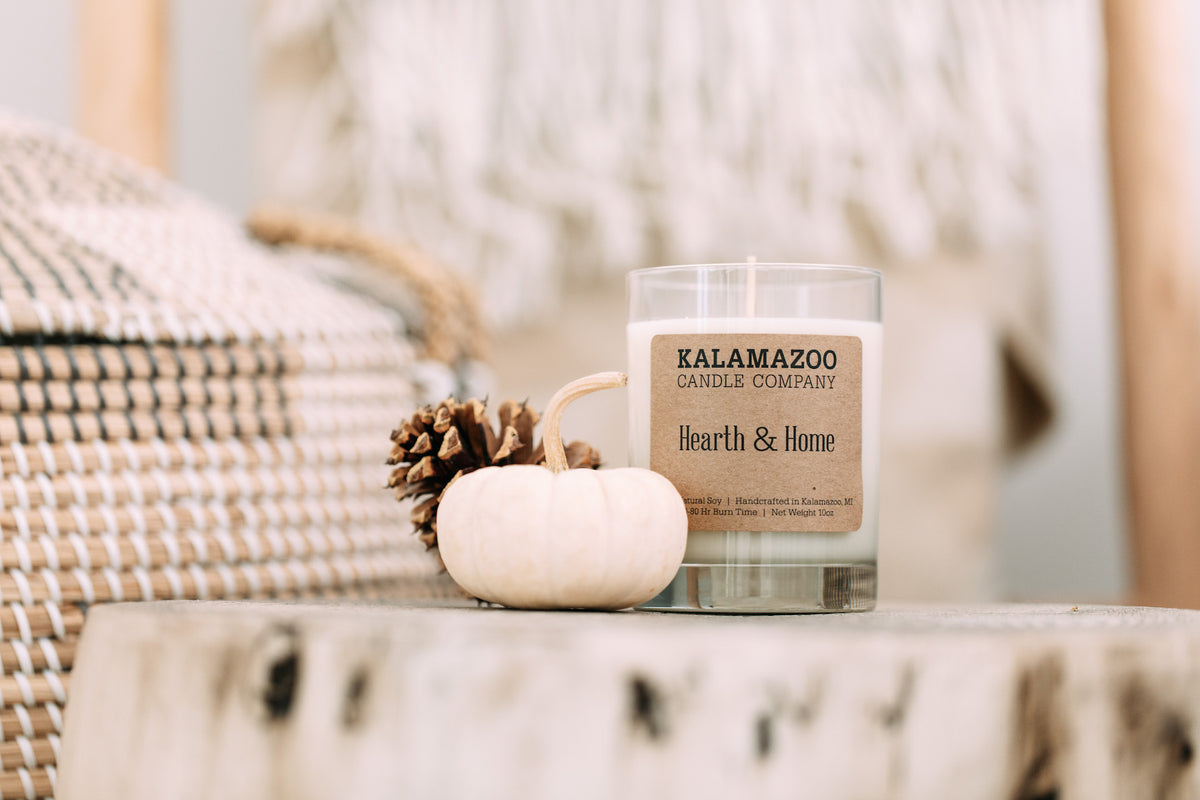 Hearth & Home Candle on a white table.