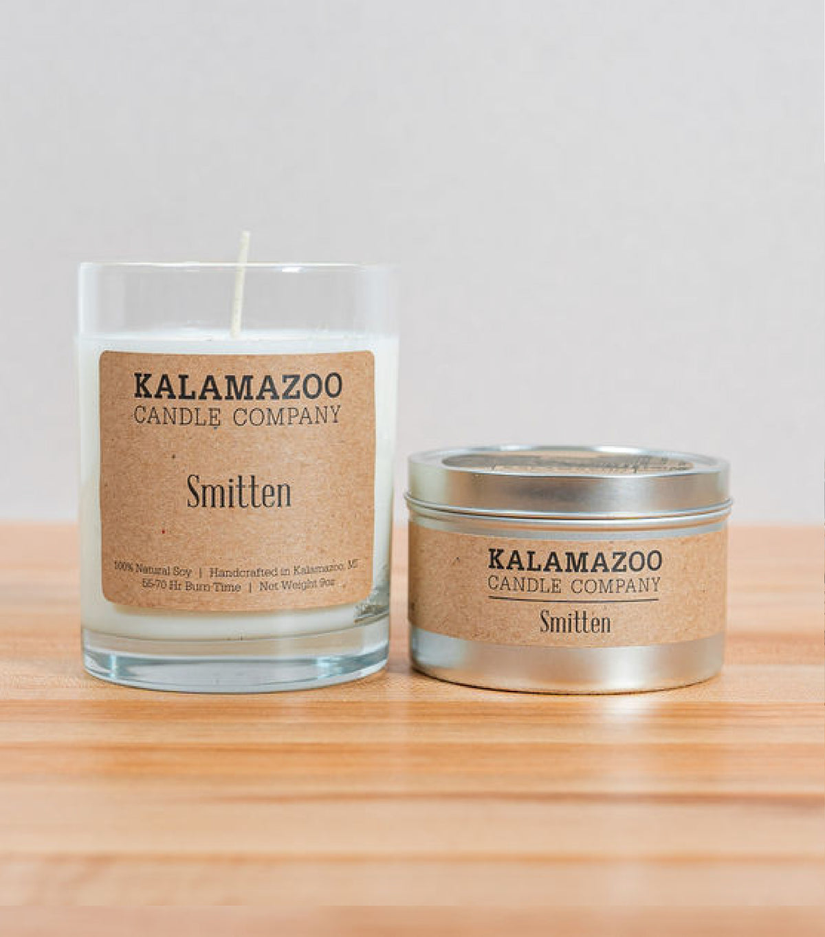 Smitten Candles A soft, sweet blend of floaty florls, sparkling citrus and creamy vanilla, this classic soy candle smells like sunshine daydreams. All Kalamazoo Candles are: 100% natural scented soy wax; produced using locally sourced and American-made ma